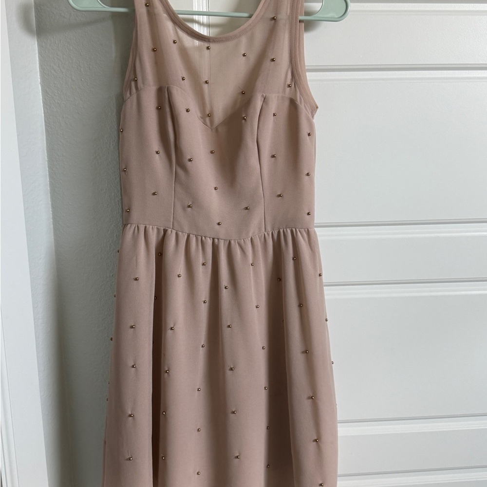 Elegant Sleeveless Dress with Studded Details